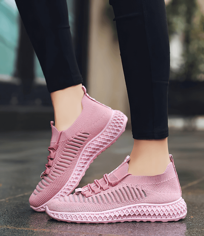 Pink mesh breathable sneakers for women, showcasing casual lace-up design and flat bottoms, ideal for everyday comfort and style.